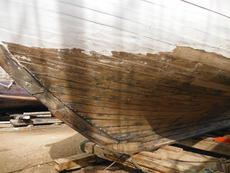 Hull under water paint stripped and recaulked