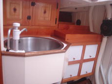 Bathroom, sink (showerhose under) and lockers