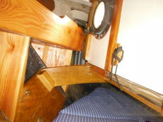 Chart locker, folded up against underside of cockpit floor